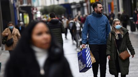 A woman in the city centre wears a face mask, as the spread of the coronavirus disease (COVID-19) continues in Dublin, Ireland, November 30, 2021