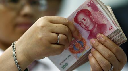 chinese man counting money