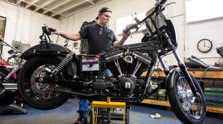 Joe Jones of Joe's Hog Doc works on a motorcycle in his bike shop in Granite City, Illinois, U.S., May 24, 2018. 