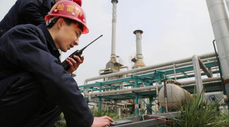 Employees work inside a factory of Pingmei Shenma Group in Baofeng County, Henan province, China, April 8, 2015. 