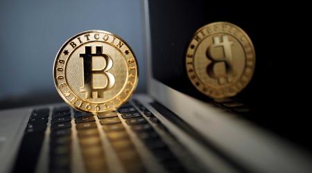 A Bitcoin (virtual currency) coin is seen in an illustration picture taken at La Maison du Bitcoin in Paris, France, June 23, 2017