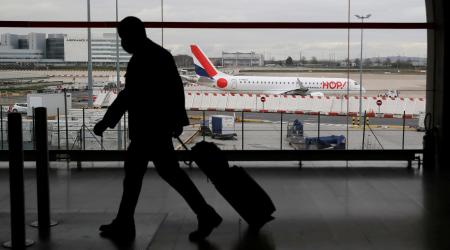 A man walks inside a Terminal at Paris Charles de Gaulle airport in Roissy near Paris as France closed borders to travellers outside European Union due to restrictions against the spread of the coronavirus disease (COVID-19) in France, February 5, 2021. 