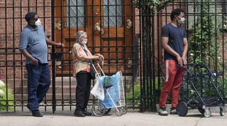 People line up at a food bank following the outbreak of coronavirus disease (COVID-19), the Manhattan borough of New York City, New York, U.S., July 30, 2020. 