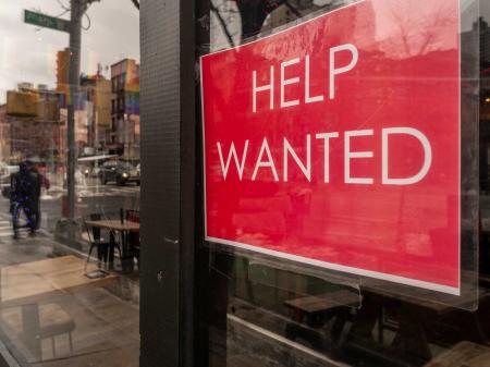Help wanted sign in a restaurant window in New York City on Sunday, January 9, 2022. 