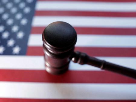 US flag and Judge gavel are seen in this photo illustration. 