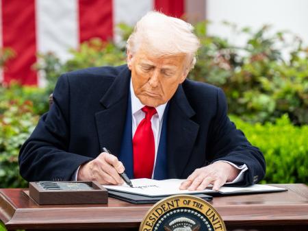President Donald Trump signing an executive order at a "Liberation Day" event where the president signed an executive order creating reciprocal tariffs, in the Rose Garden at the White House in Washington, D.C.
