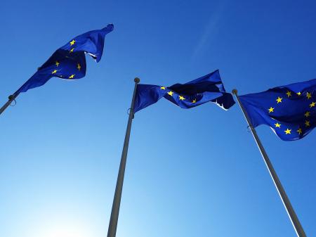 EU flags flutter outside the EU Commission headquarters in Brussels, Belgium. March 2025. 