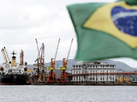 Cargo ships are loaded with containers at a port near Sao Paulo, Brazil. 