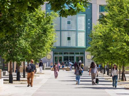 University students walk in front of the Peter J. Shields Library on the campus of the University of California, Davis. April 2025. 