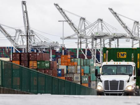 Shipping containers await to be unloaded at the port of Oakland in California. May 2025.