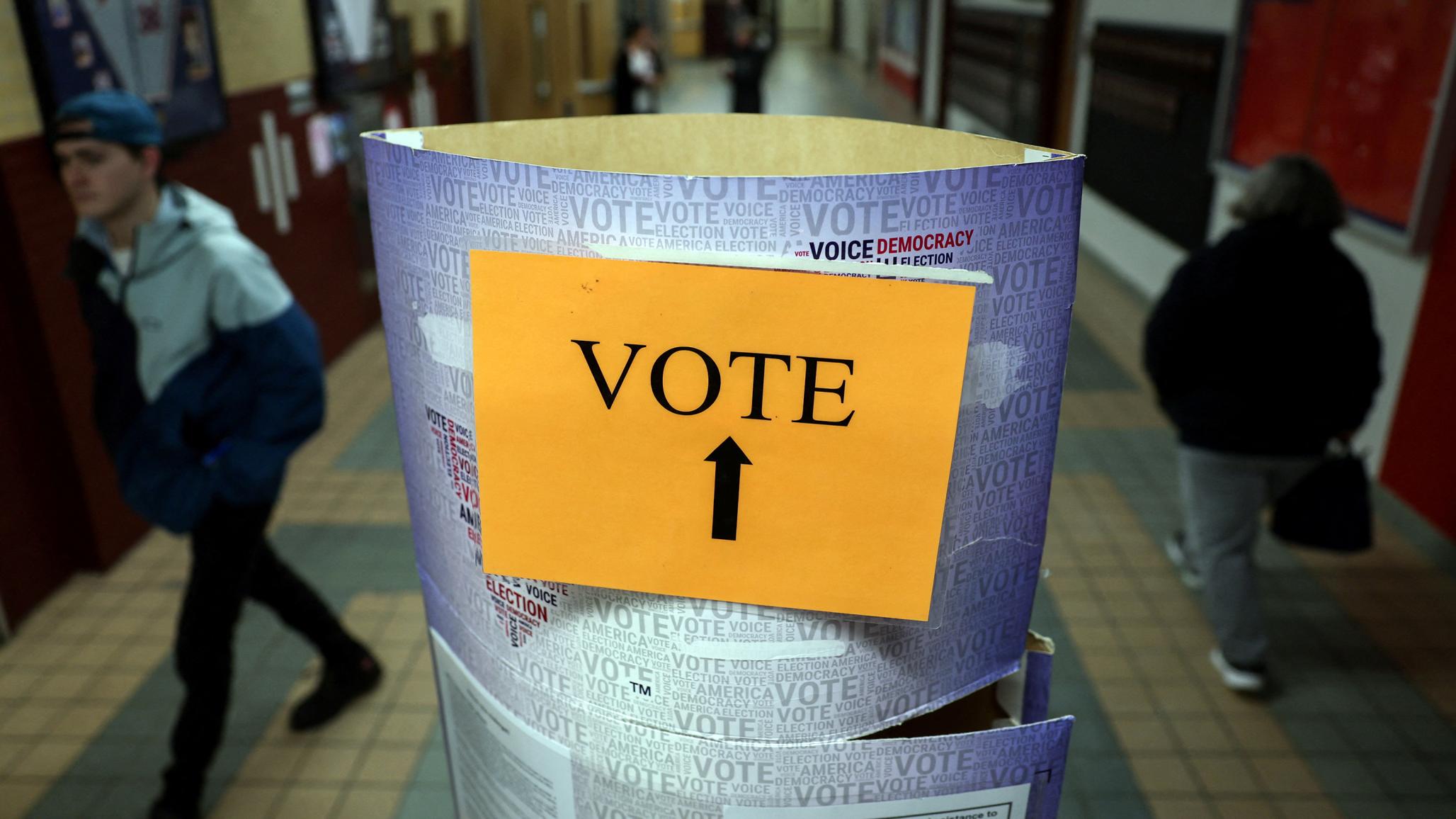 Voters arrive to cast their ballots in Manchester, New Hampshire, U.S., January 23, 2024.