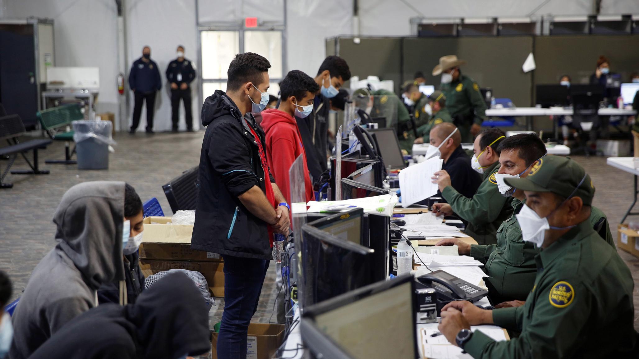 Migrants are processed at the intake area of the Department of Homeland Security holding facility, in Texas. March 30, 2021. 
