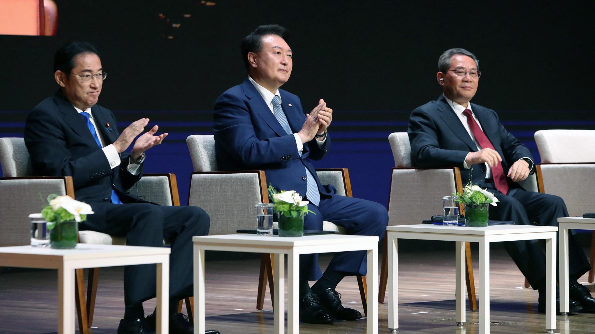 Japanese Prime Minister Fumio Kishida, South Korean President Yoon Suk Yeol, and Chinese Premier Li Qiang attend the business summit at the Korea Chamber of Commerce and Industry on May 27, 2024 in Seoul, South Korea.