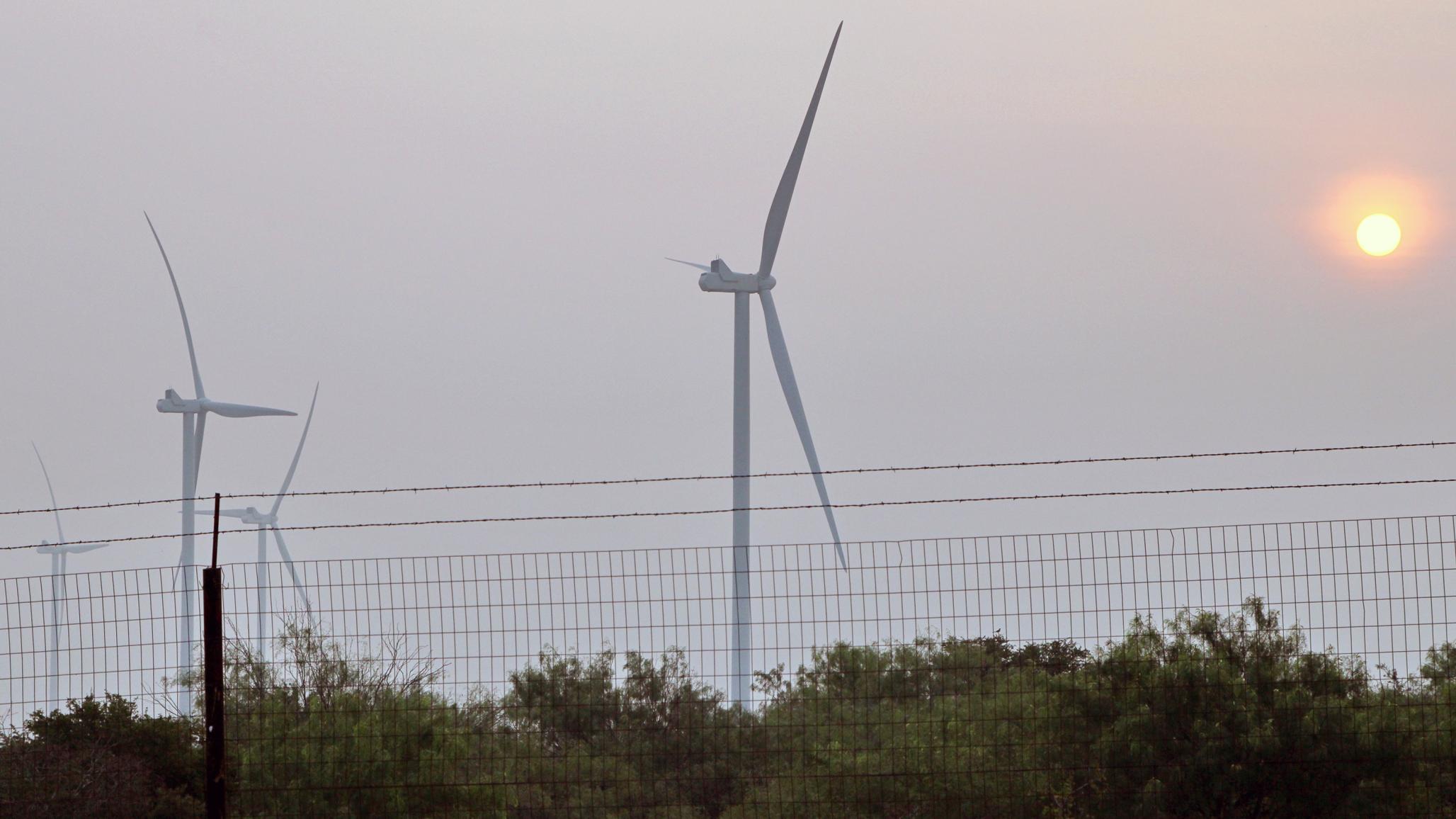 The early morning sun bears down on brushlands and wind turbines near a reservoir in Starr County, Texas, where water levels are at historic lows. Picture taken on May 16, 2024. 