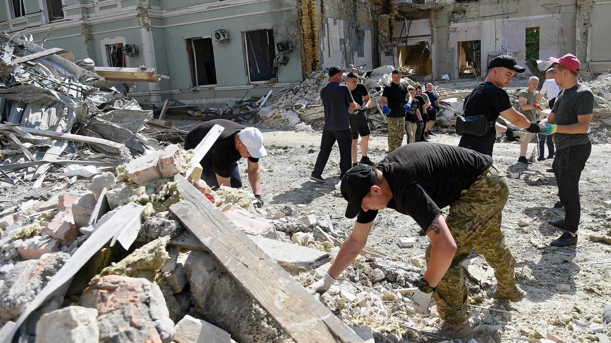 Volunteers help clean the premises of the Ohmatdyt National Specialized Children’s Hospital destroyed by the Russian missile attack on July 8 in Kyiv, Ukraine. 