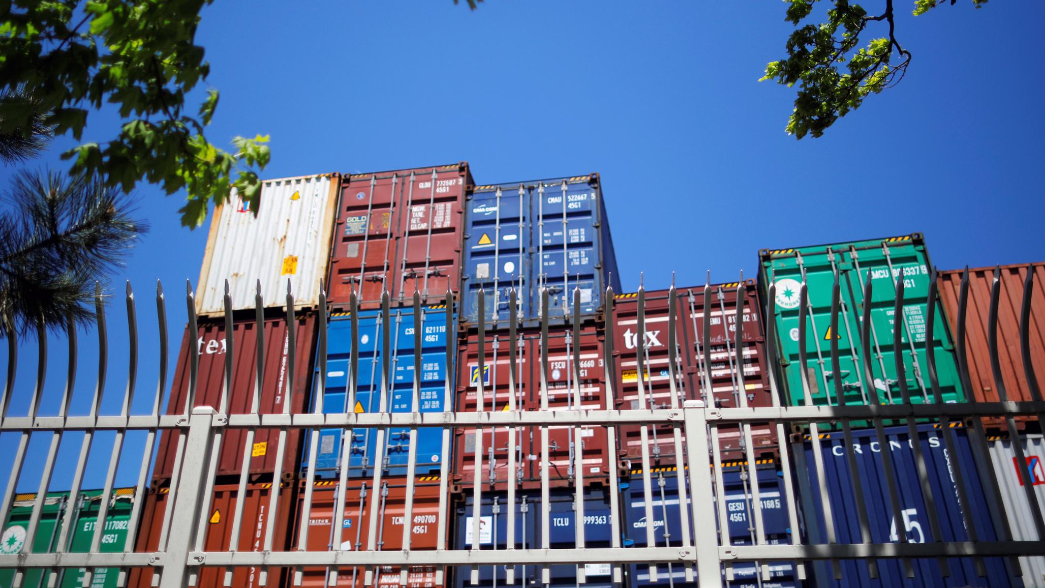 Shipping containers are stacked at a container terminal in Boston, Massachusetts, US. 