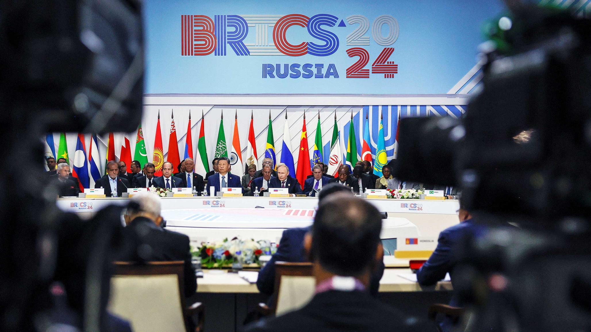 Officials, including Russian President Vladimir Putin, Chinese President Xi Jinping, and Egyptian President Abdel Fattah al-Sisi, meet at the BRICS summit in Kazan, Russia. October 24, 2024. 