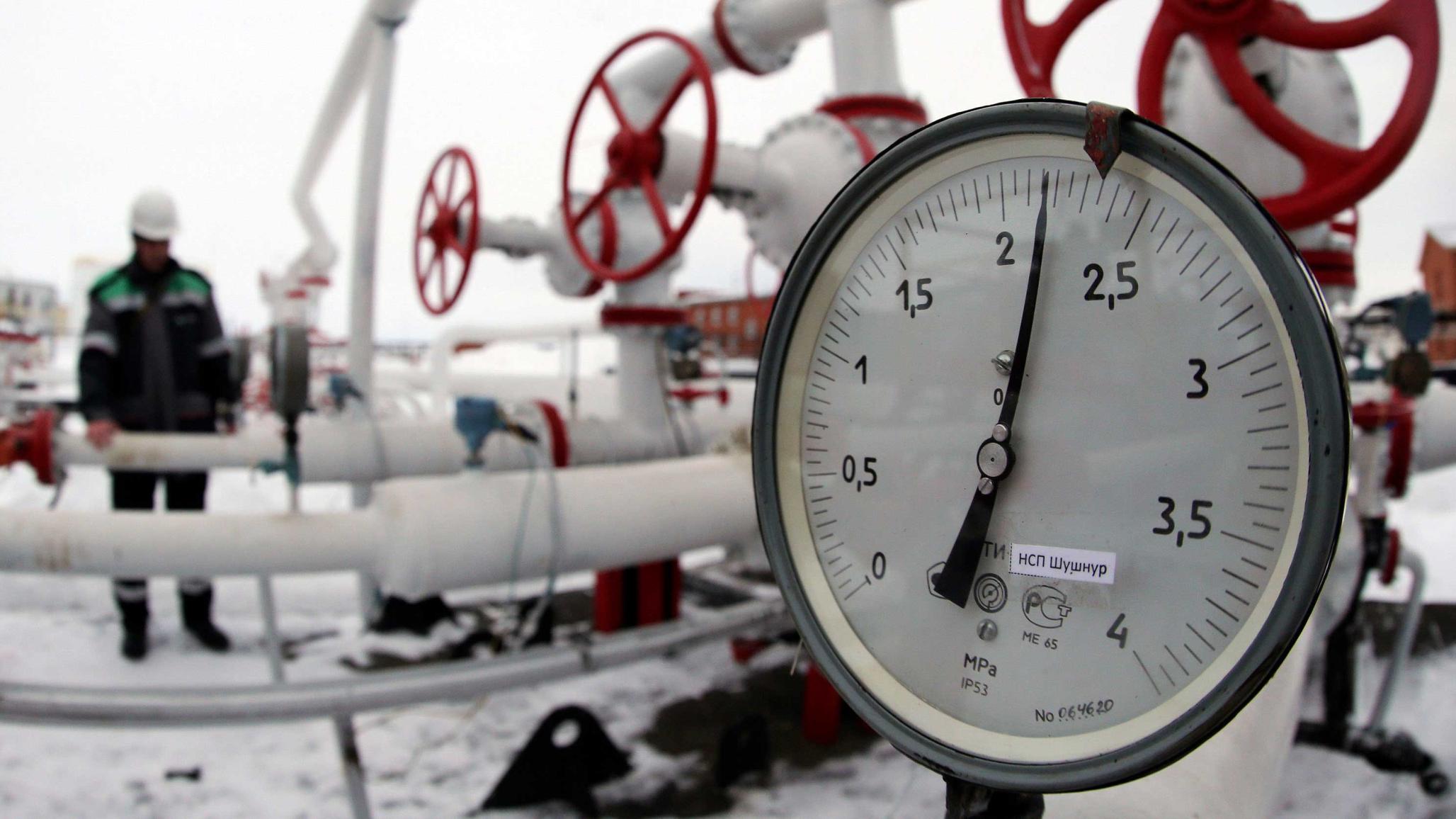 A worker inspects valves and pipes at an oil gathering station near Ufa Russia. 