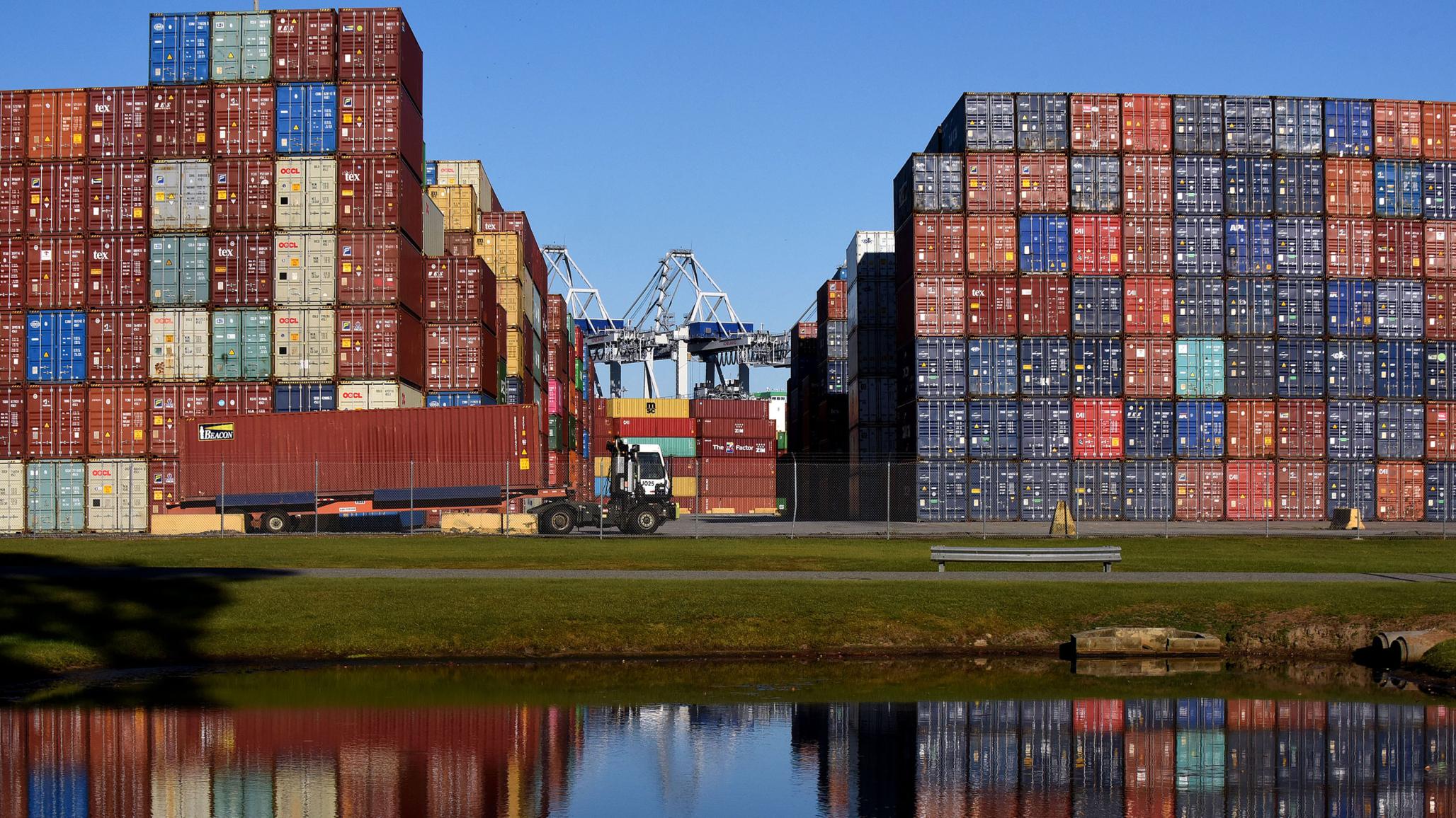 A truck picks up a shipping container at the Port of Savannah in Georgia.