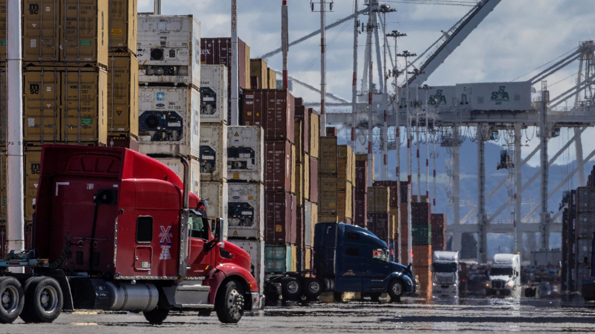 Shipping containers and trucks are seen at the port in Oakland, CA as trade tensions escalate over US tariffs. Picture taken on March 6, 2025. 