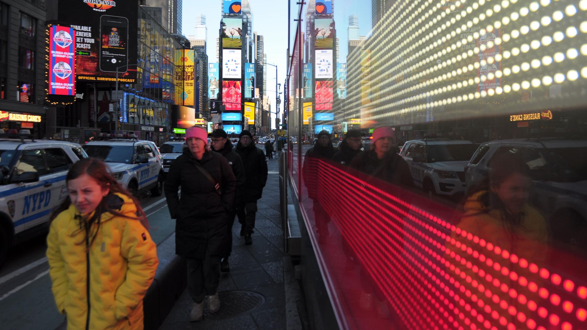 People walk in Times Square, Manhattan, New York City. Picture taken March 7, 2025. 