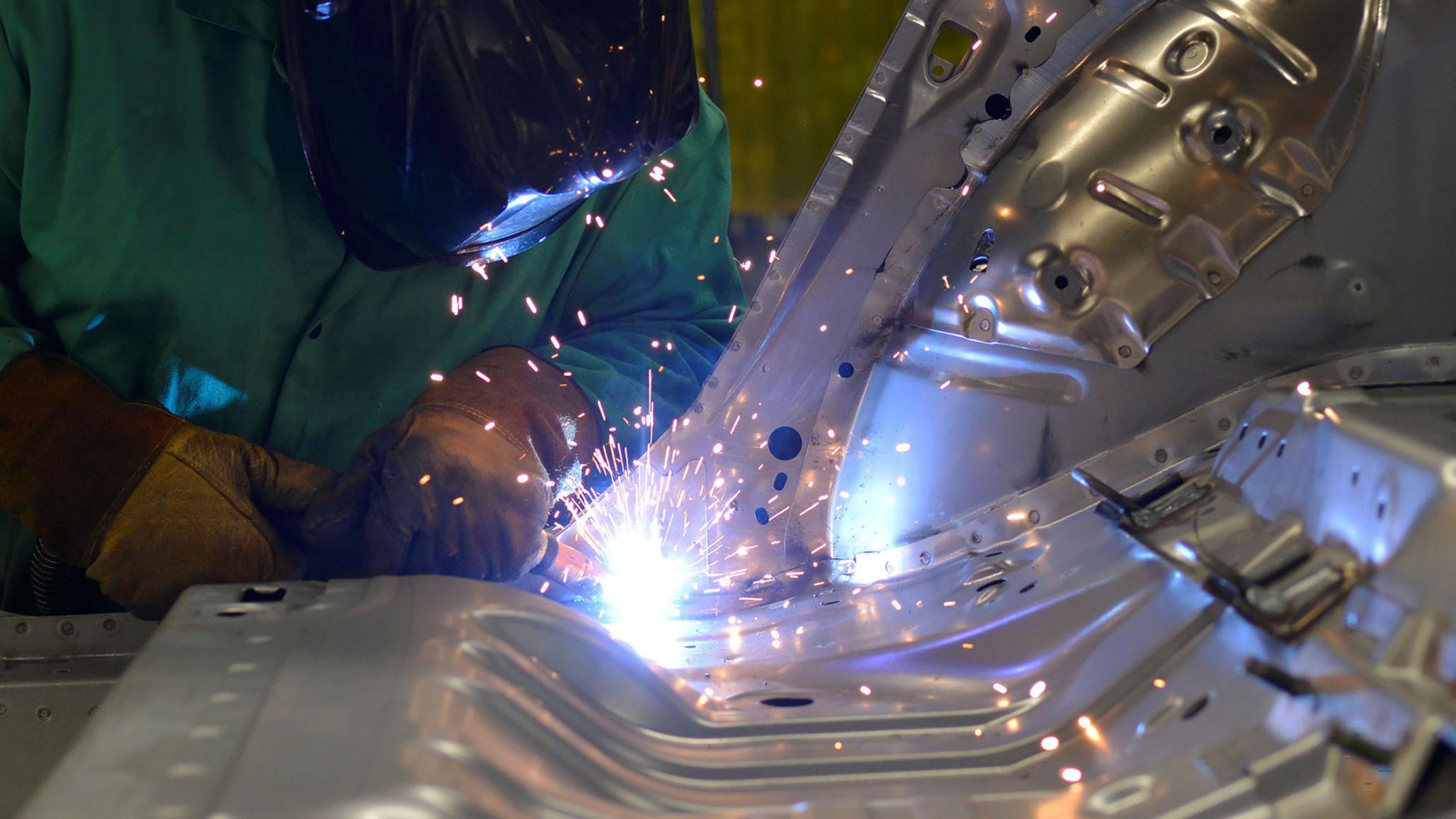 Line workers weld parts at a manufacturing plant in Smyrna, Tennessee. 