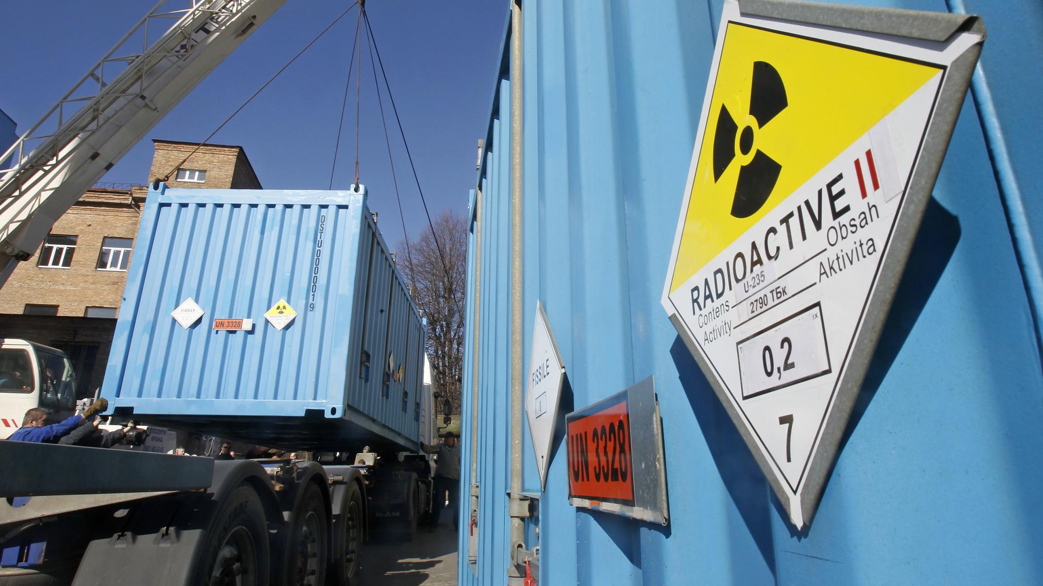 Workers place containers with spent HEU on a truck at a nuclear research facility in Kiev, under an agreement with the US to eliminate stocks of HEU. Pictures taken March 2012. 