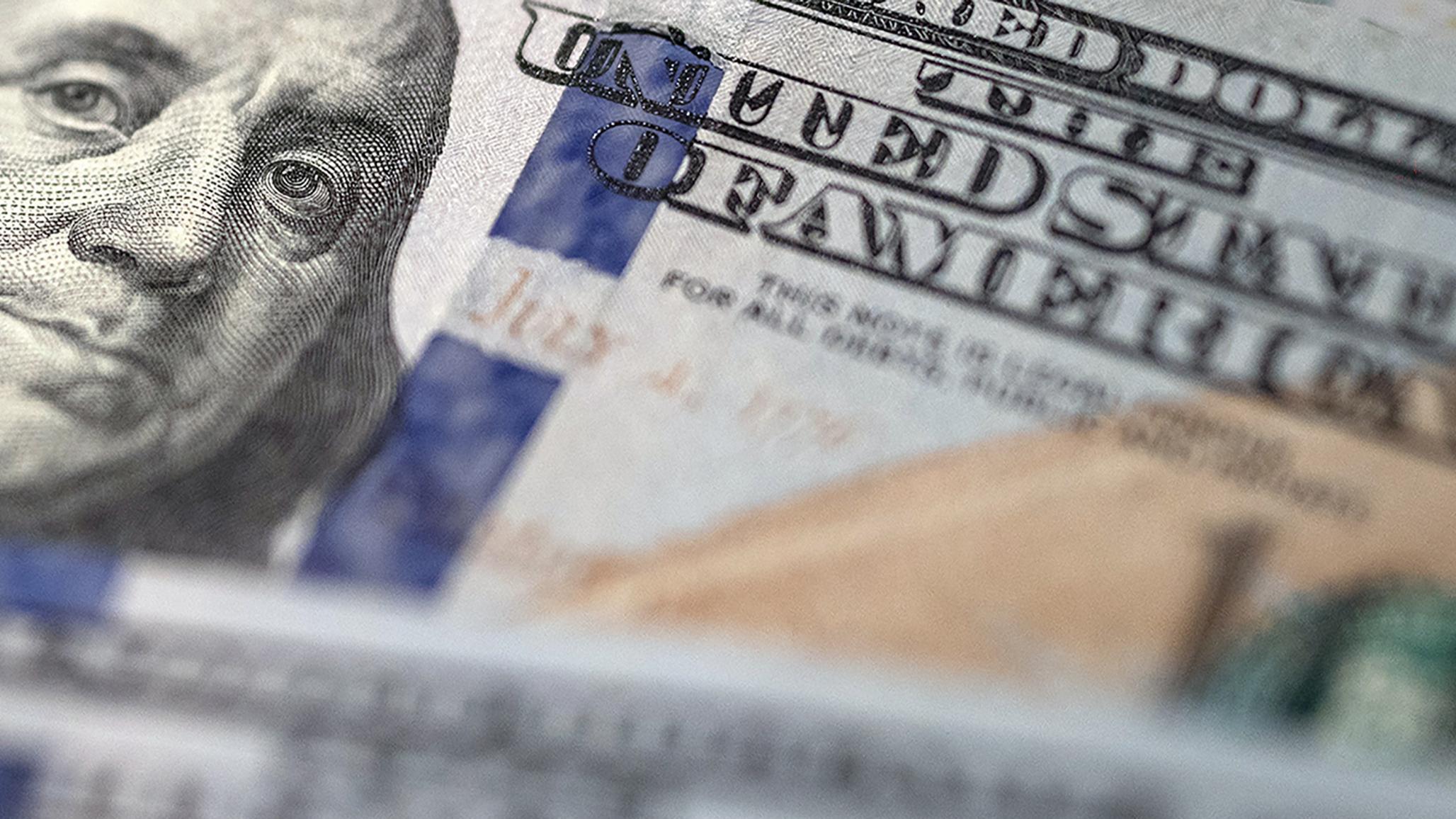 US one hundred dollar bills are shown in this picture illustration. 