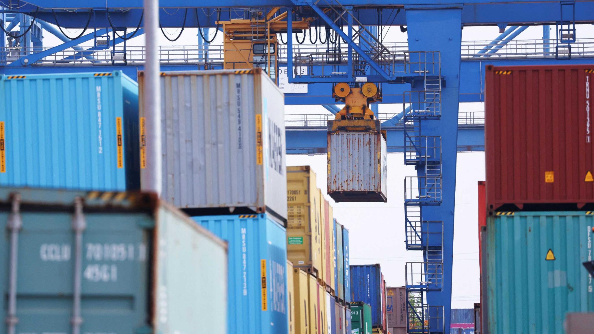 A crane lifts a container at a loading terminal in Germany, after US President Donald Trump threatened on Saturday to impose a 30% tariff on imports from Mexico and the European Union, starting on August 1. Picture taken on July 14, 2025. 