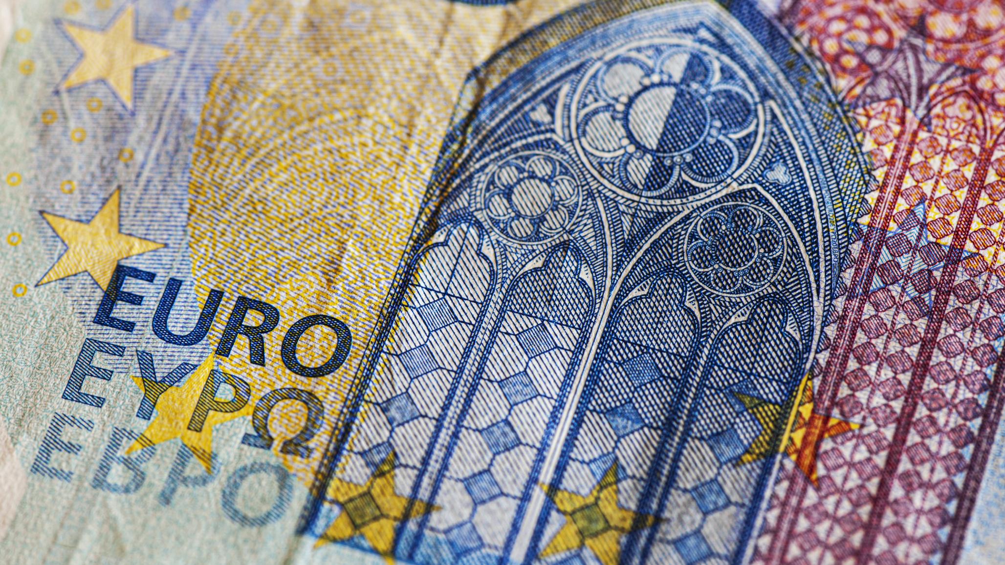 A euro banknote is shown in detail in this photo illustration.