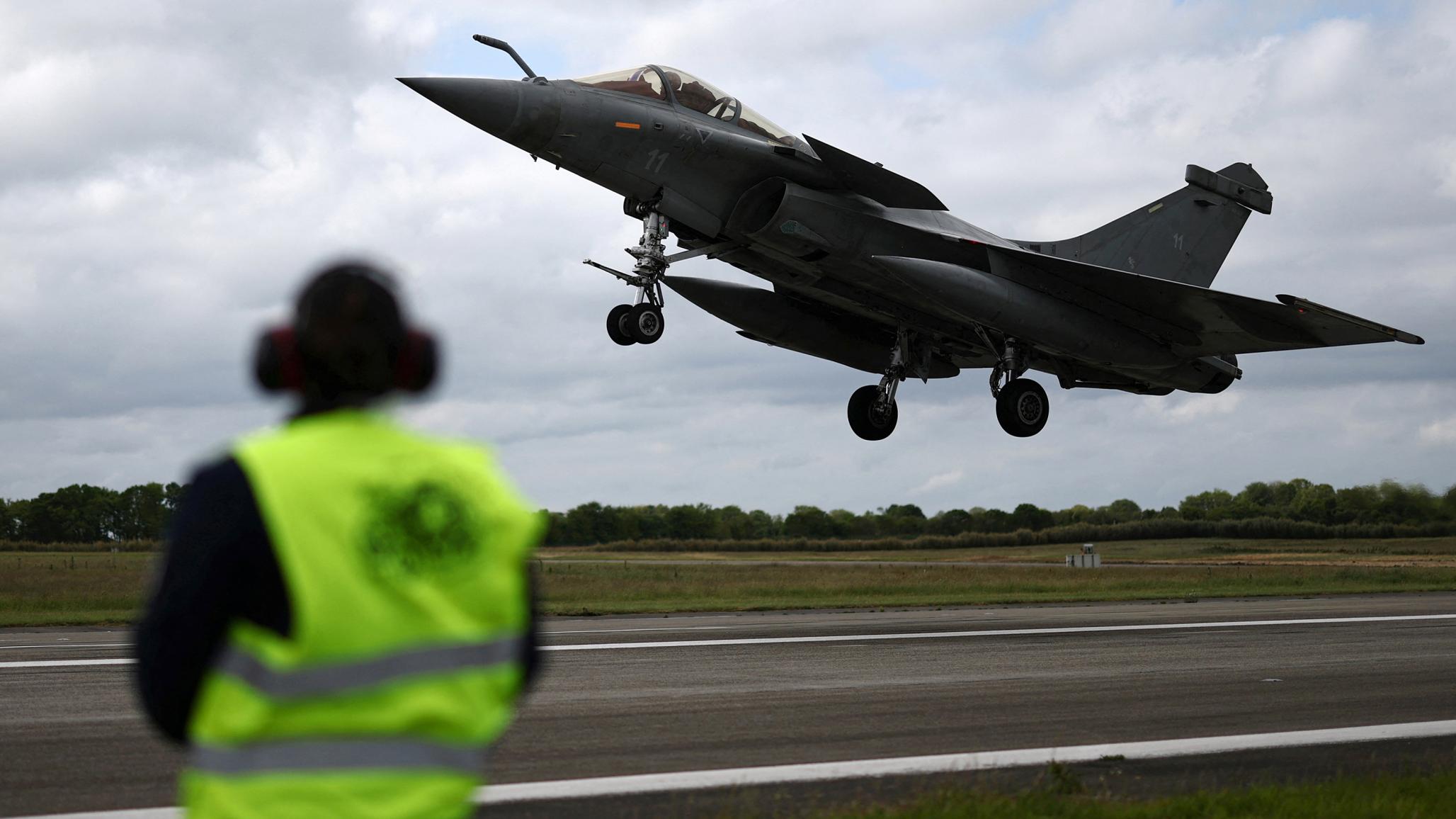 A French fighter aircraft Rafale M, takes part in a practice session on an aircraft carrier at the Landivisiau Navy Air Base in Saint-Servais, Brittany, France. May 7, 2025. 