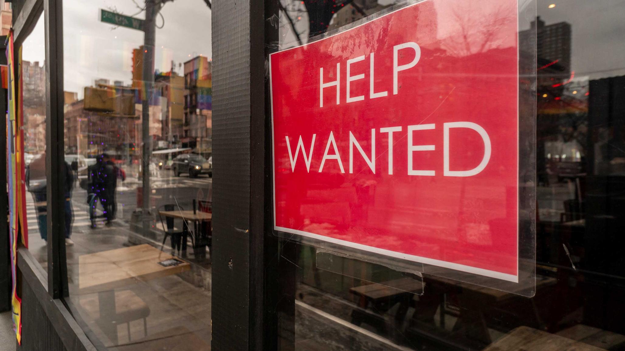 Help wanted sign in a restaurant window in New York City on Sunday, January 9, 2022. 