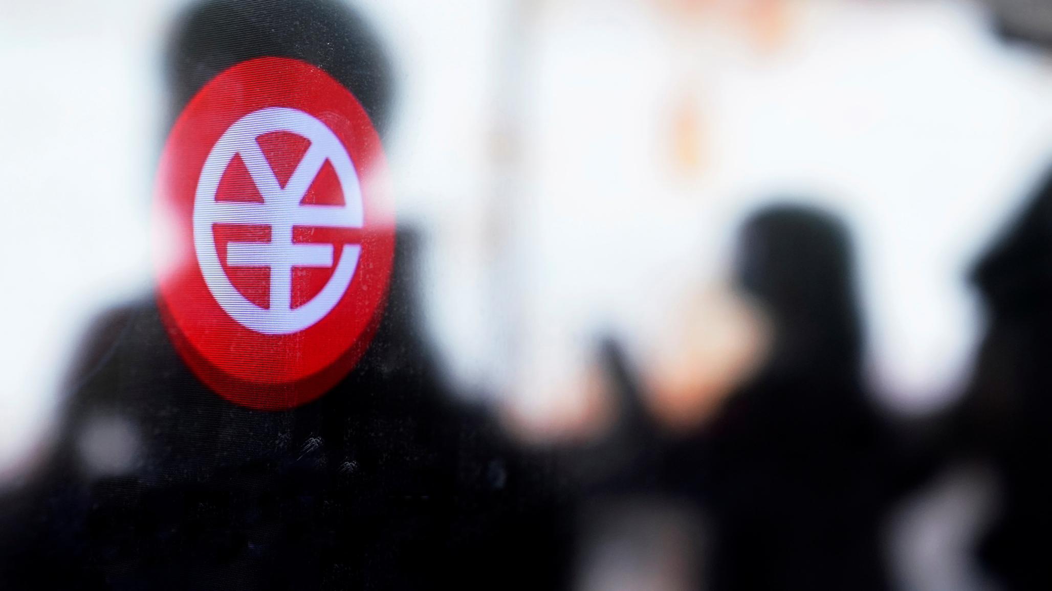 A sign indicating digital yuan is pictured on a vending machine at a subway station in Shanghai, China. 