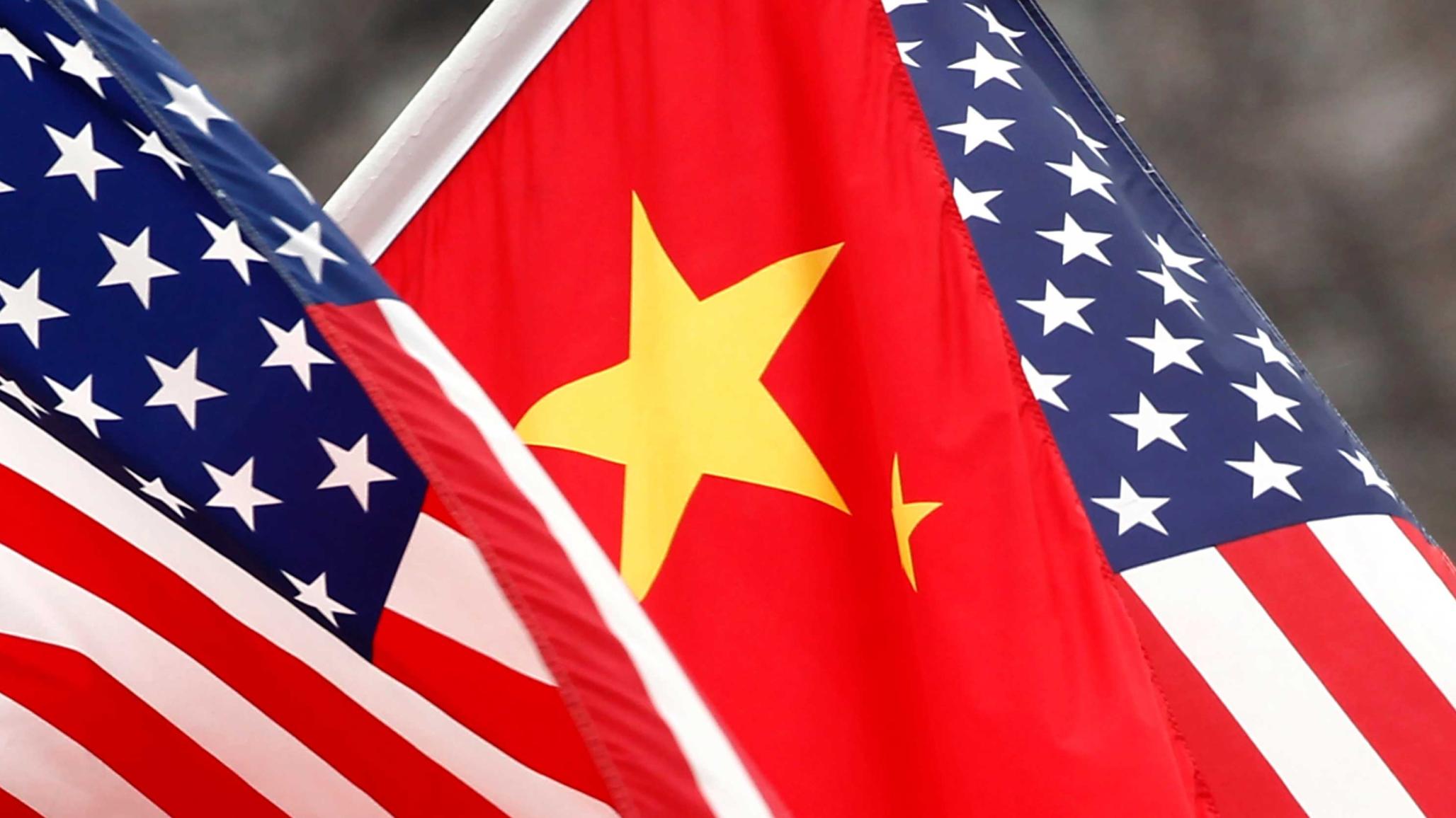 Chinese and US flags are displayed. 
