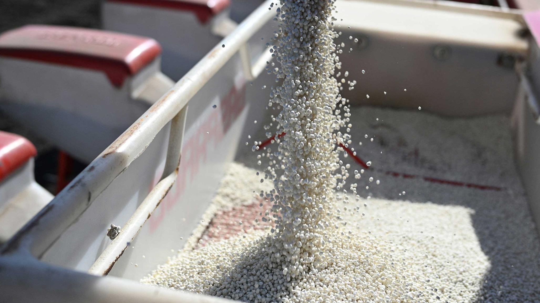 Fertilizer is loaded into a seeder, but the ongoing conflict in Iran has disrupted global fertilizer supplies, particularly through the Strait of Hormuz. 