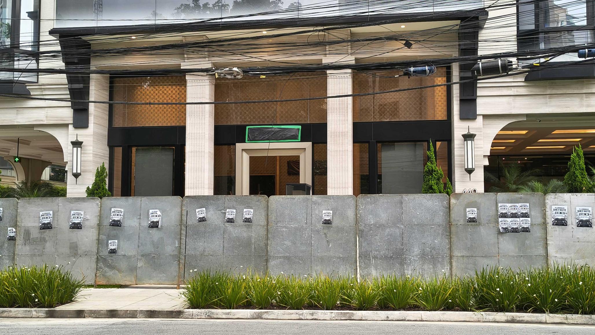 This image shows the Banco Master building protected by hoardings and with the bank's logo covered in plastic in Sao Paulo, Brazil, on January 26, 2026, after Brazil's Central Bank orders its shutdown due to a major liquidity crunch and ''serious violations'' of financial regulations. 