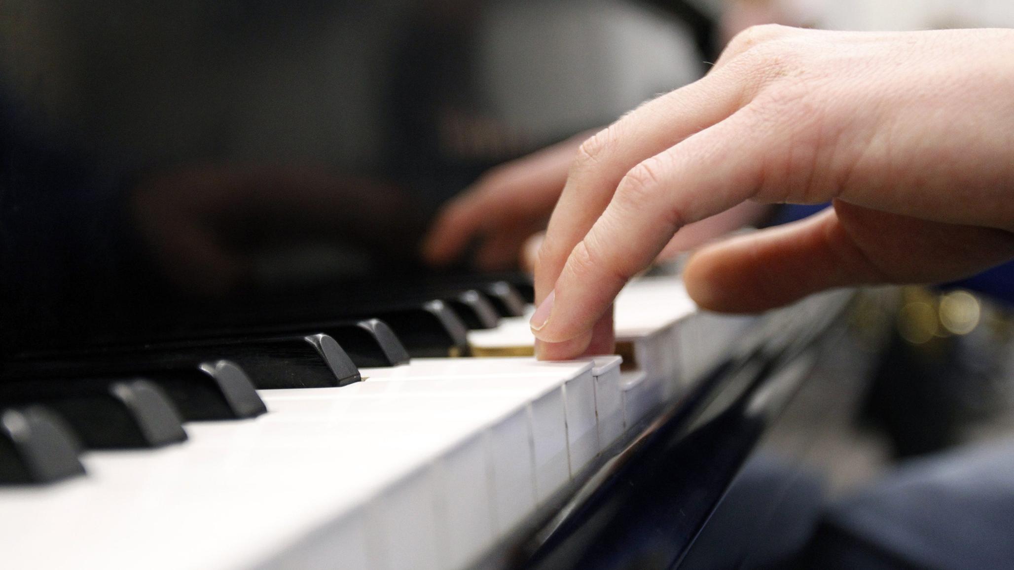 A piano is being played at a music store in Wisconsin. 