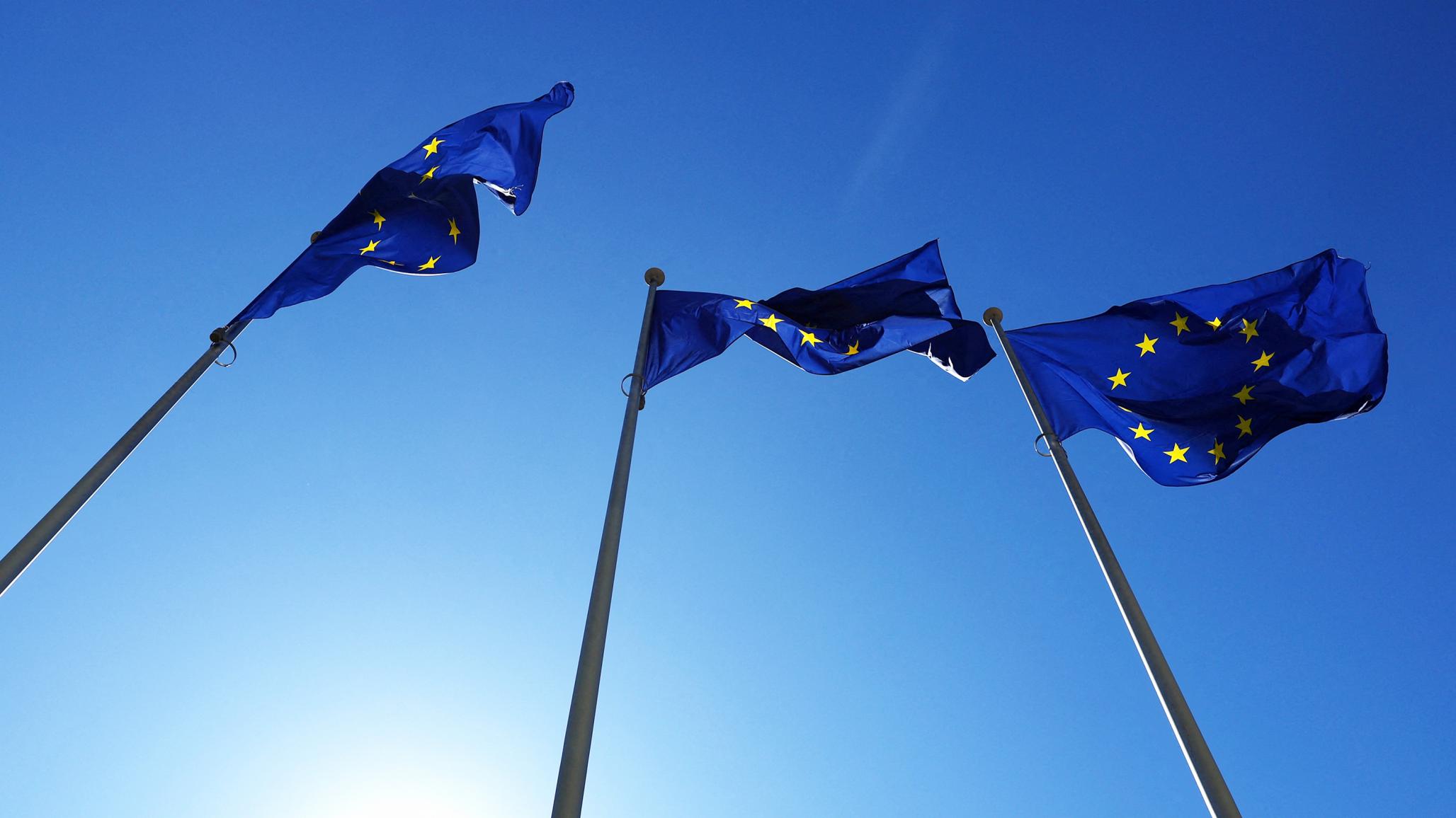 EU flags flutter outside the EU Commission headquarters in Brussels, Belgium. March 2025. 