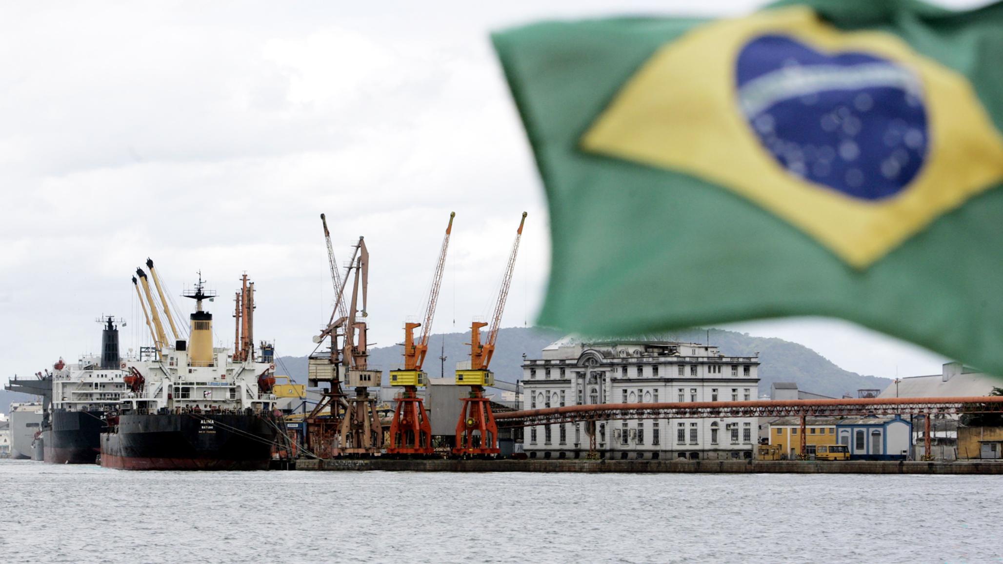 Cargo ships are loaded with containers at a port near Sao Paulo, Brazil. 
