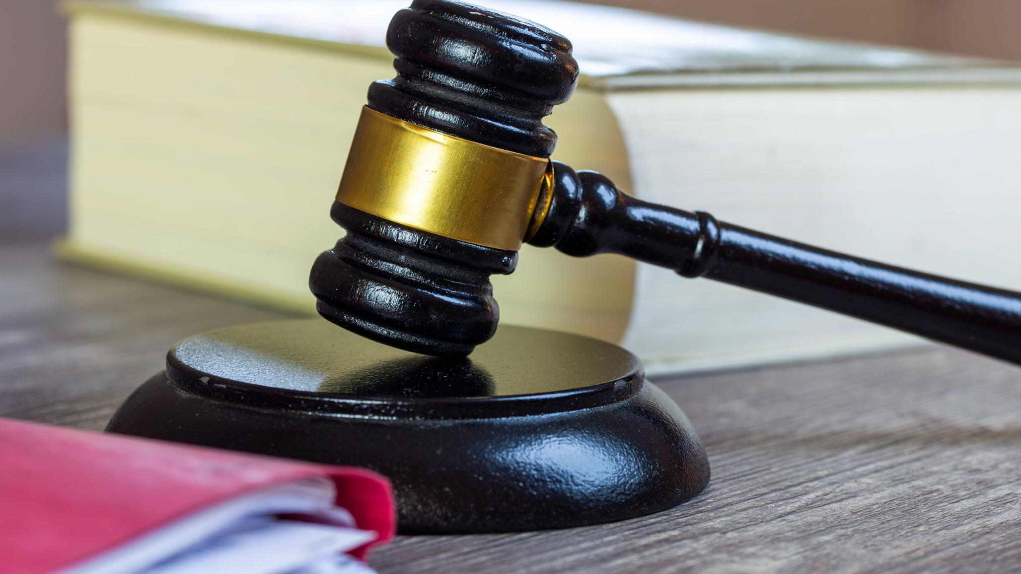 A close-up of a judge's gavel is shown in this photo illustration. 