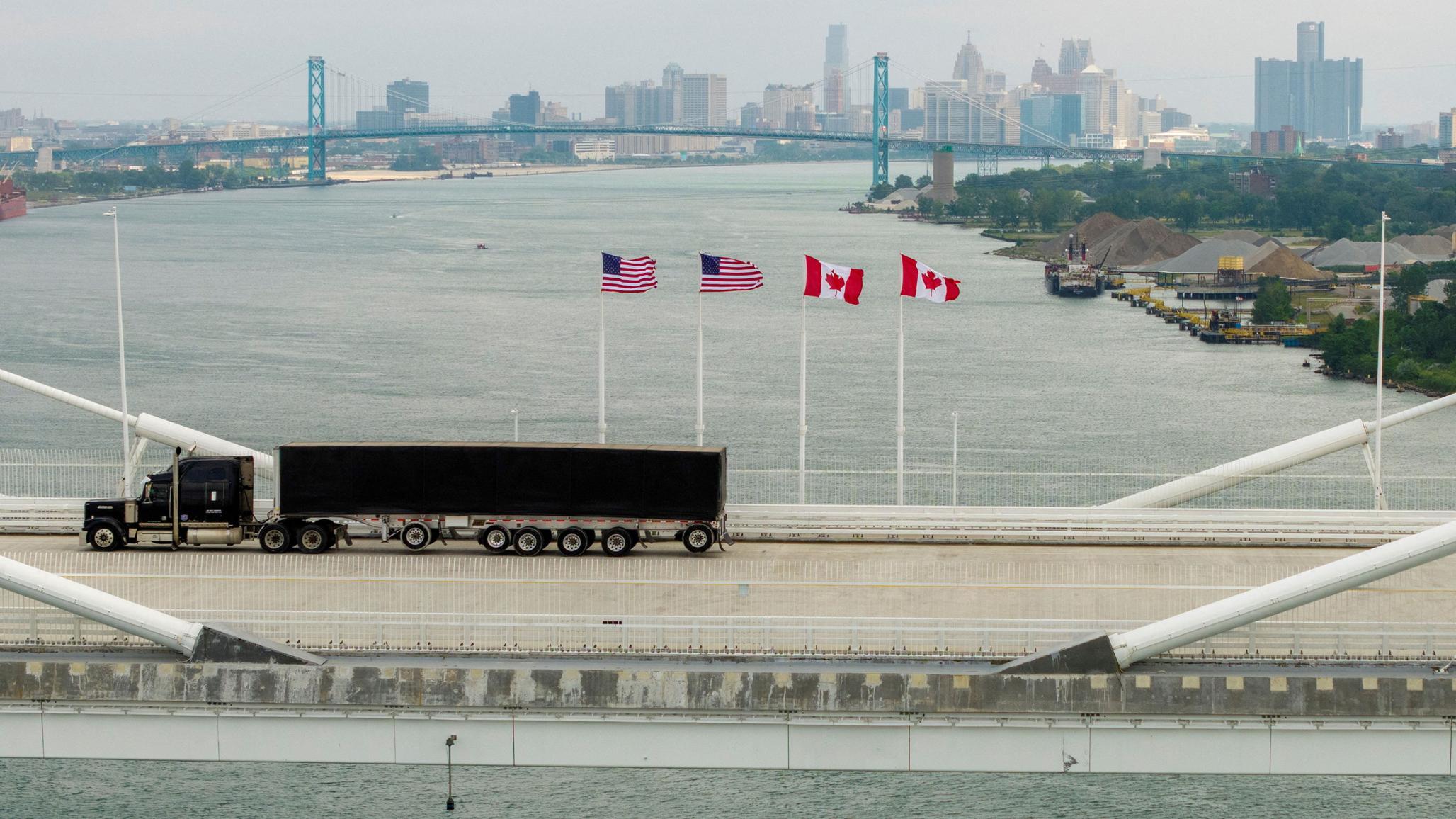 A truck hauls goods across a bridge linking the US and Canada, as trade between the two countries are now threatened by President Trump's legally, economically, and politically questionable tariffs. July 2026. 