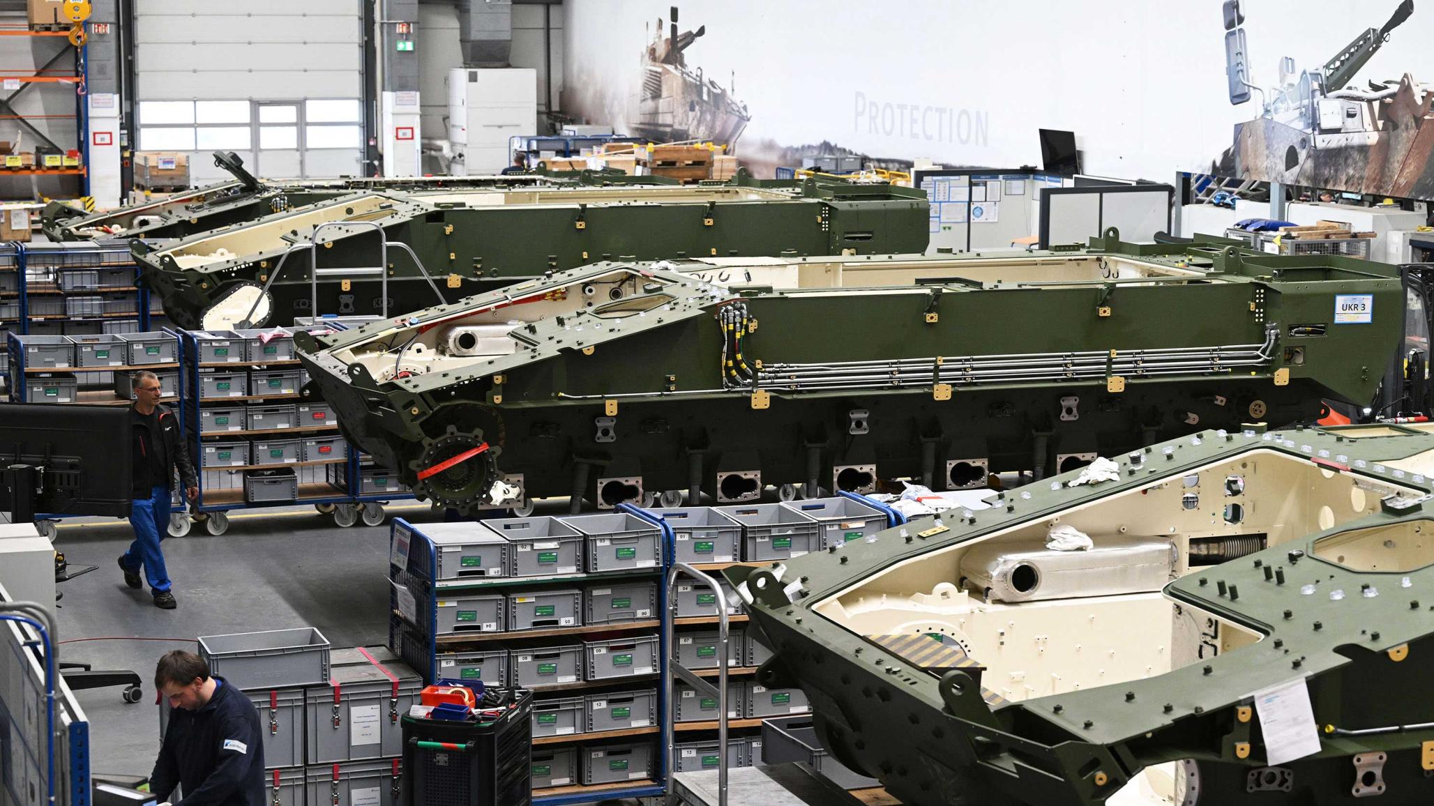 Armored combat vehicles are assembled at a manufacturing facility in Germany. May 2025. 