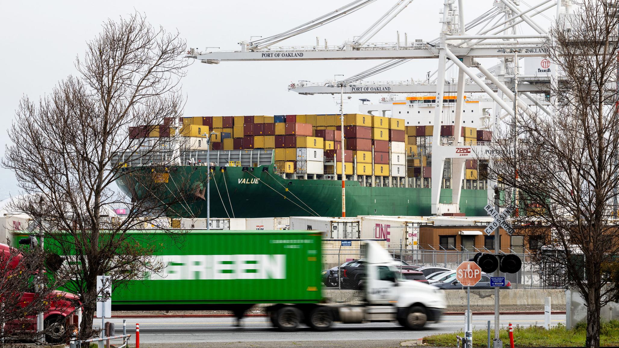 Cargo moves through a busy port in the US as tariffs affect imports and consumer prices. February 2026. 