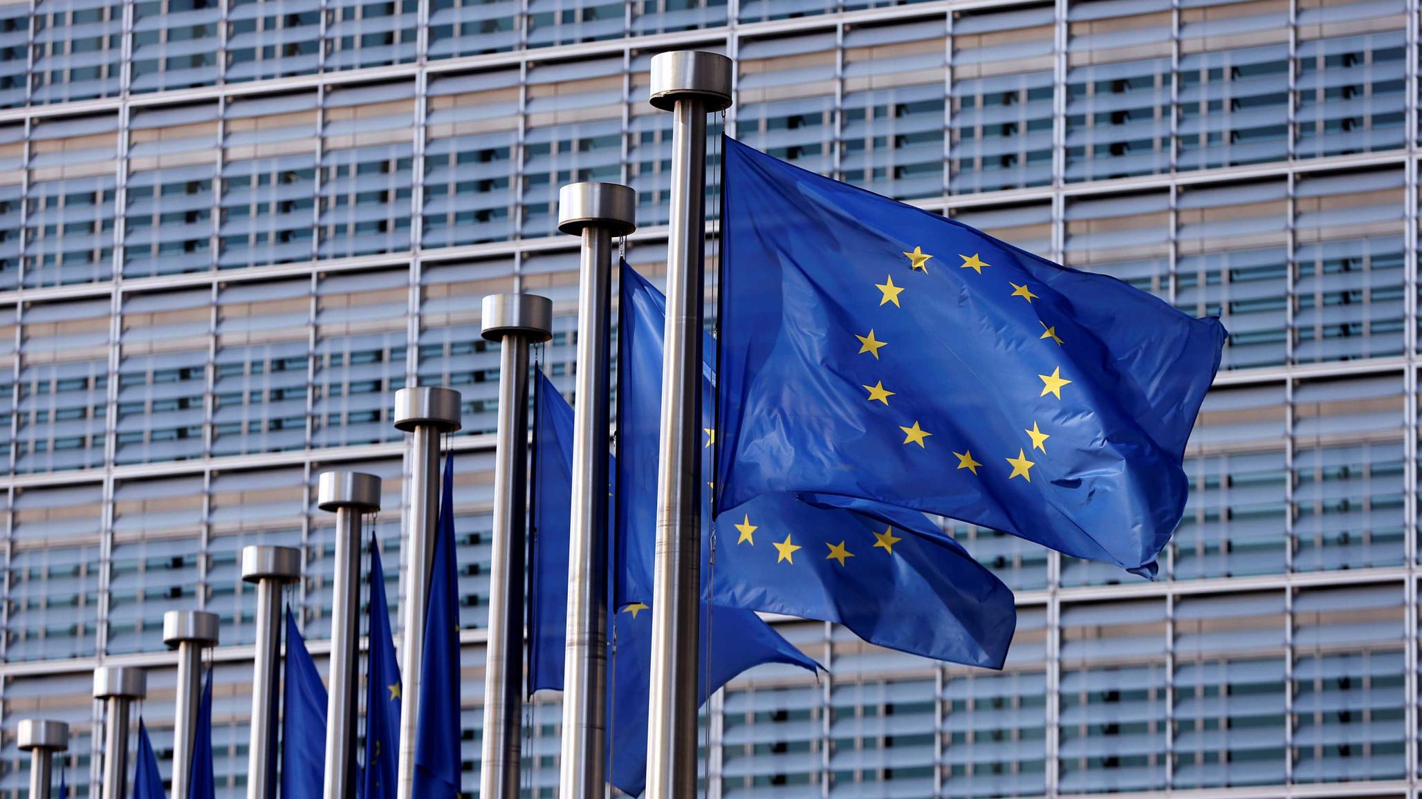 European Union flags flutter outside the EU Commission headquarters in Brussels, Belgium, April 20, 2016. 