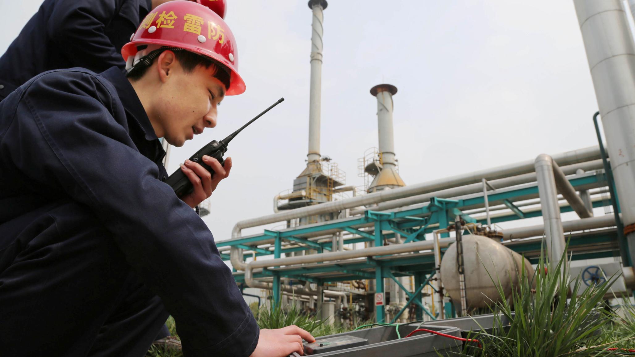 Employees work inside a factory of Pingmei Shenma Group in Baofeng County, Henan province, China, April 8, 2015. 