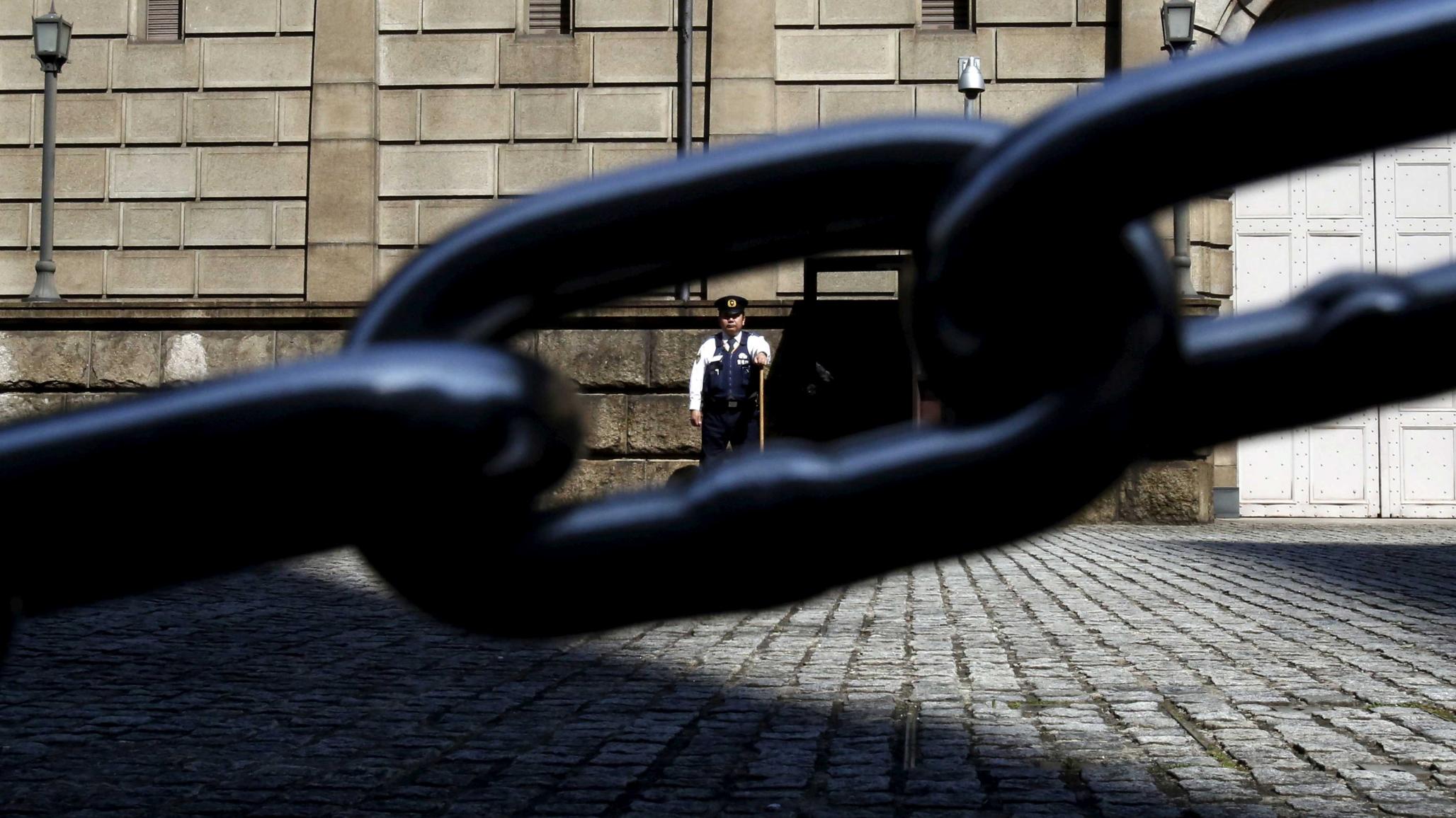 Security officer outside the Bank of Japan headquarters, Tokyo, Japan